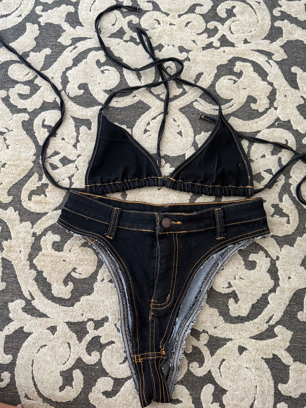 Black denim bikini set with adjustable straps and high-waisted bottoms